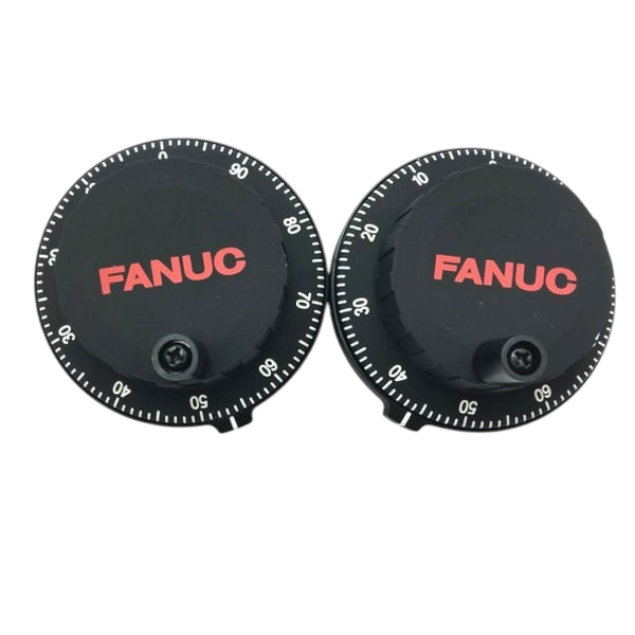 Two black FANUC manual pulse generator handwheels with white markings and red branding on a white background