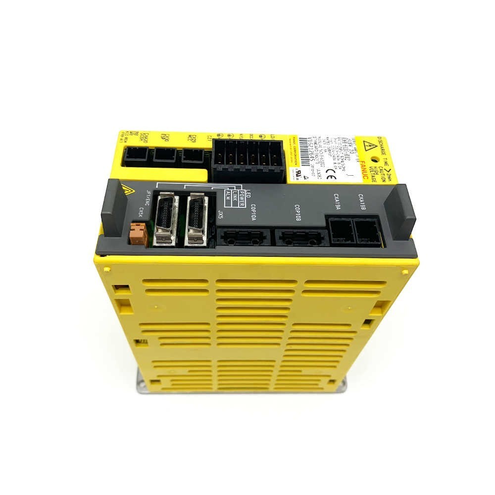 JJAutomation yellow FANUC industrial servo amplifier module with labeled ports for CNC and robotic control systems.