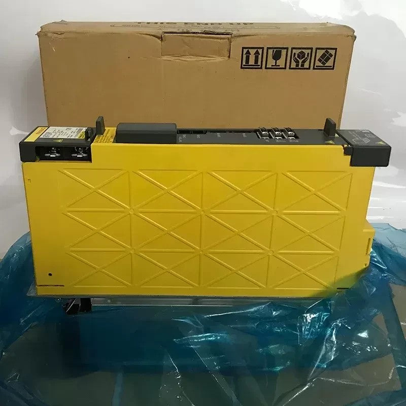 JJAutomation Fanuc Alpha i SVM2-40/40i dual-axis servo amplifier module in yellow casing with original box.