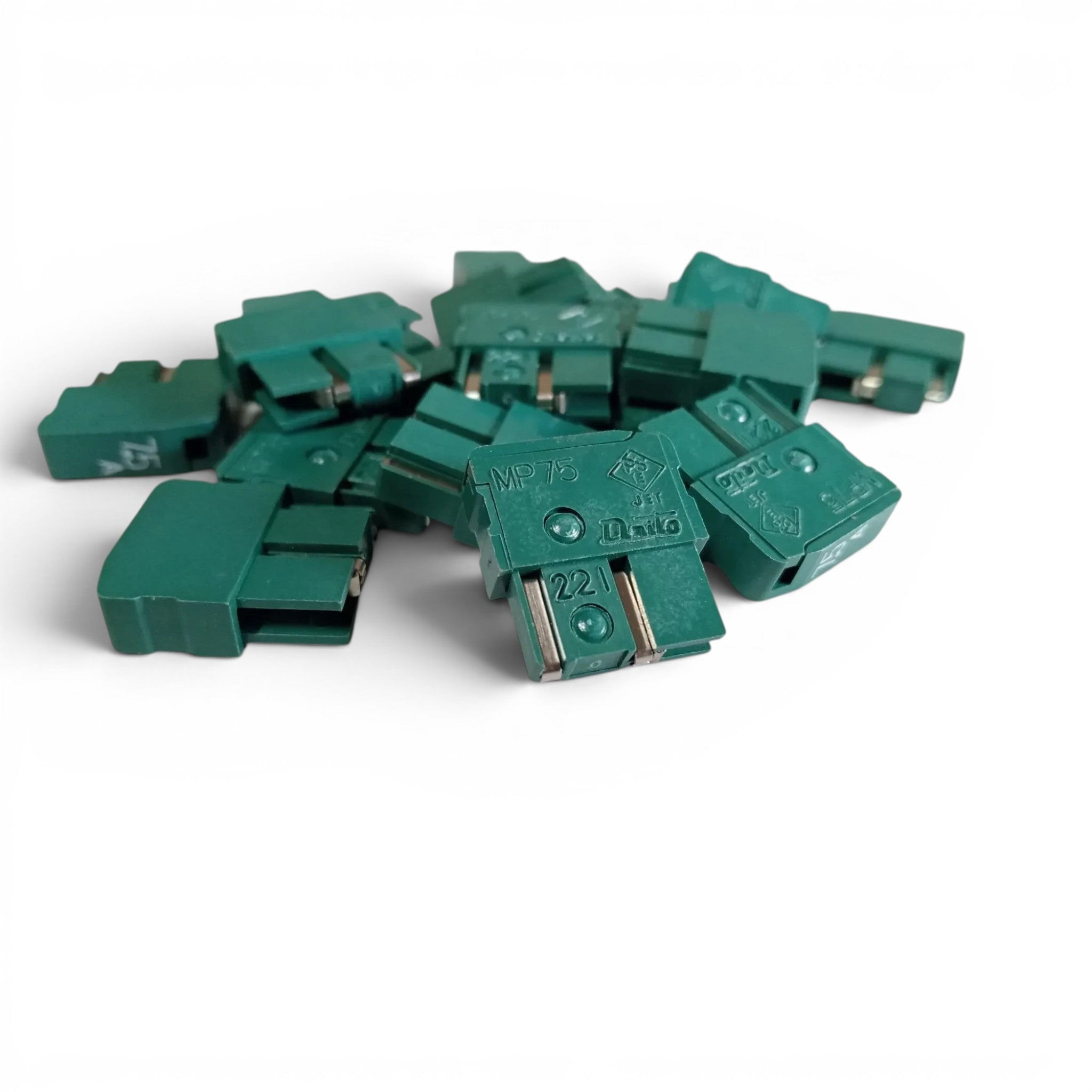 Pile of green Daito MP75 7.5A CNC fuses, model A60L-0001-0046#MP75, available from JJAutomation.