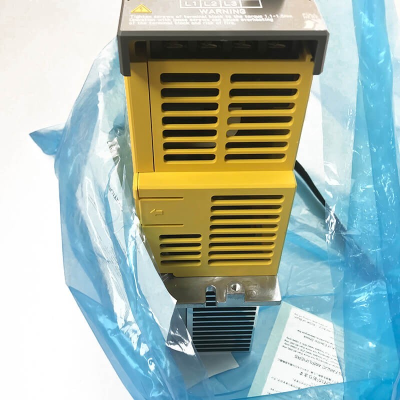 JJAutomation Fanuc αiPSs 18HV-B power supply module in yellow, featuring cooling vents and warning labels.