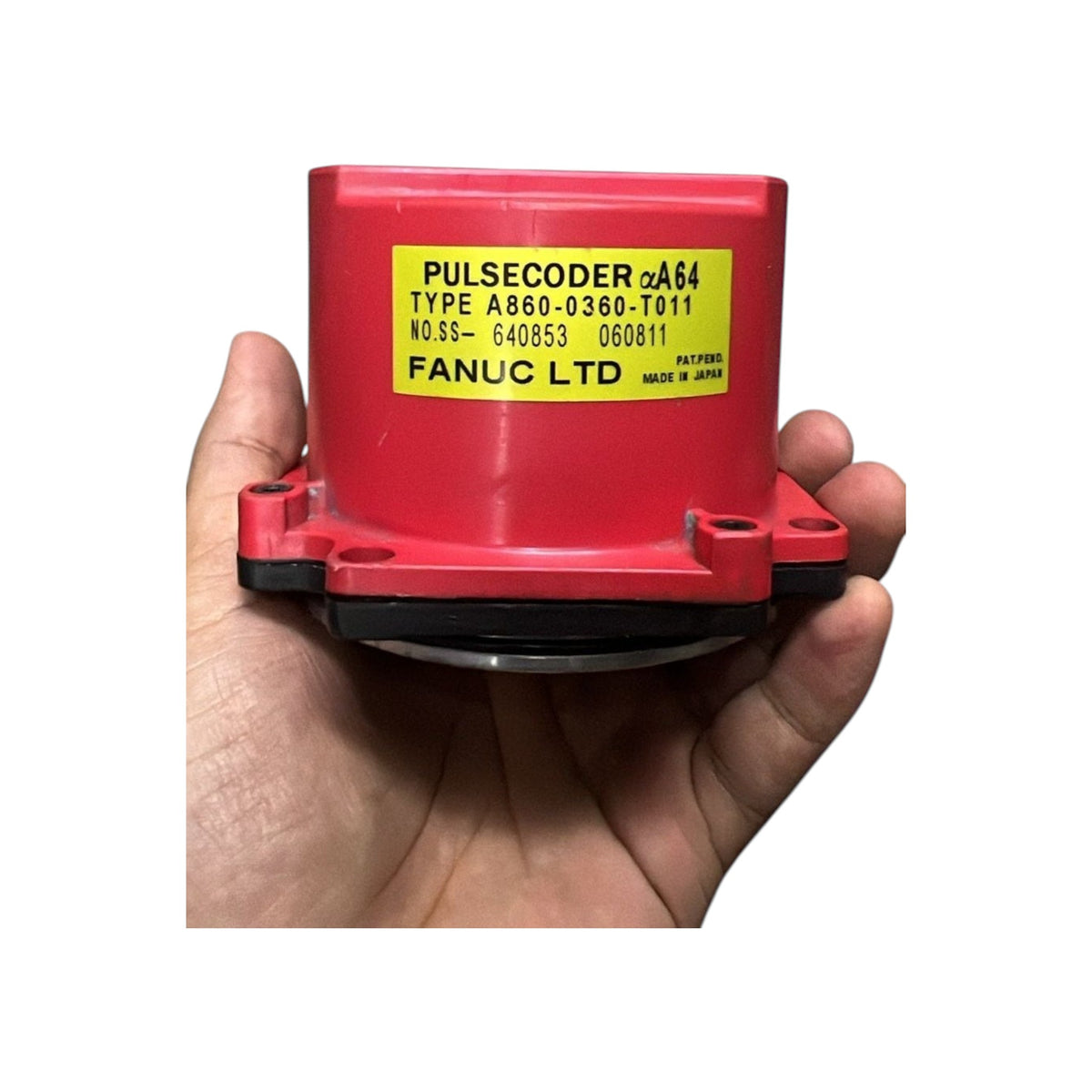 JJAutomation Fanuc A860-0360-T011 alpha A64 pulse coder with backup capacitor held in a hand