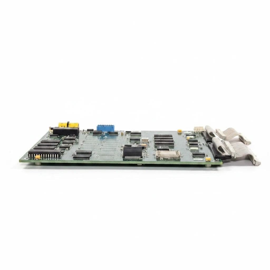 JJAutomation green industrial PCB with integrated circuits, memory chips, and ribbon cable connectors.