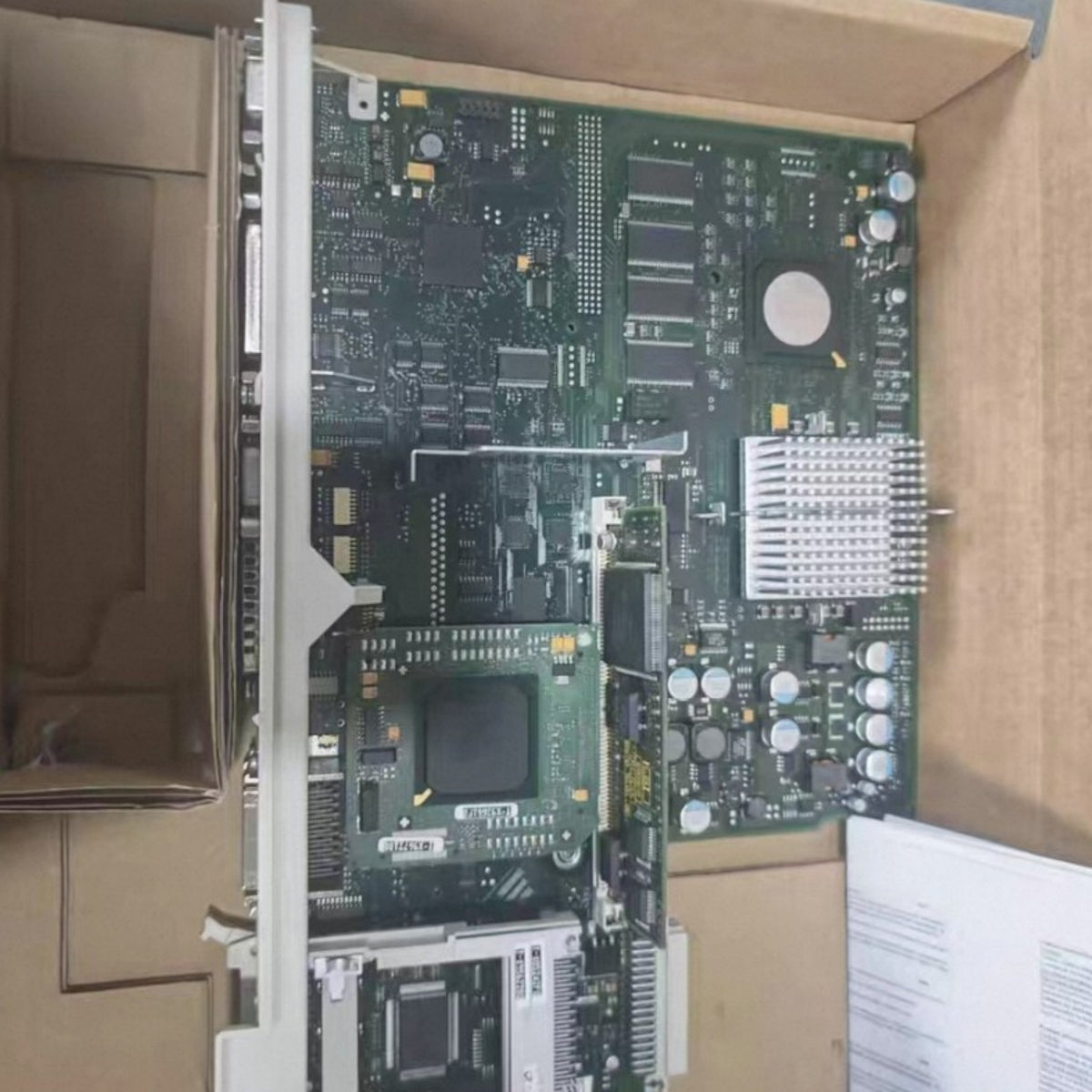 JJAutomation Siemens SINUMERIK 840D NCU 573.5 numerical control unit board inside a protective shipping box